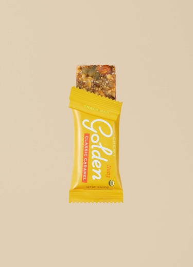 One half unwrapped nut and seed Classic Caramel Get Golden bar